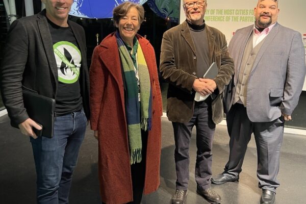 Dan Caeser (Fully Charged joint CEO), Bridget Phelps (outgoing Chair EVA England), Robert Llewellyn (Fully Charged joint CEO), Warren Philips (New Chairman EVA England) at COP26.